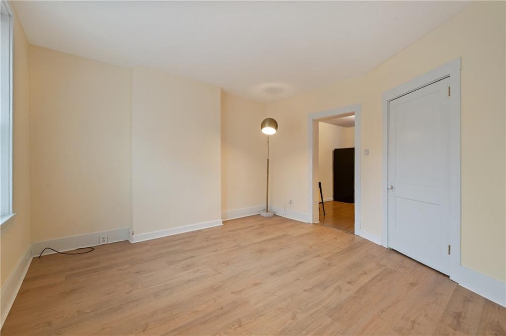 368 44th Street Pittsburgh, PA 15201 - Photo 11 of 39 a view of an empty room with wooden floor and a window