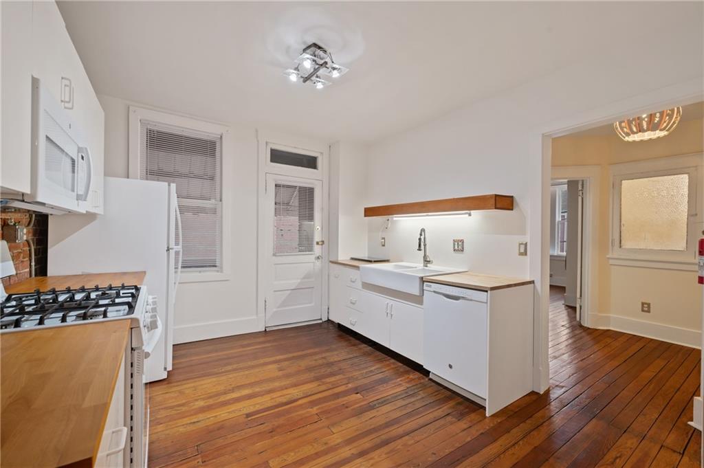 368 44th Street Pittsburgh, PA 15201 - Photo 19 of 39 a view of kitchen with sink and wooden floor