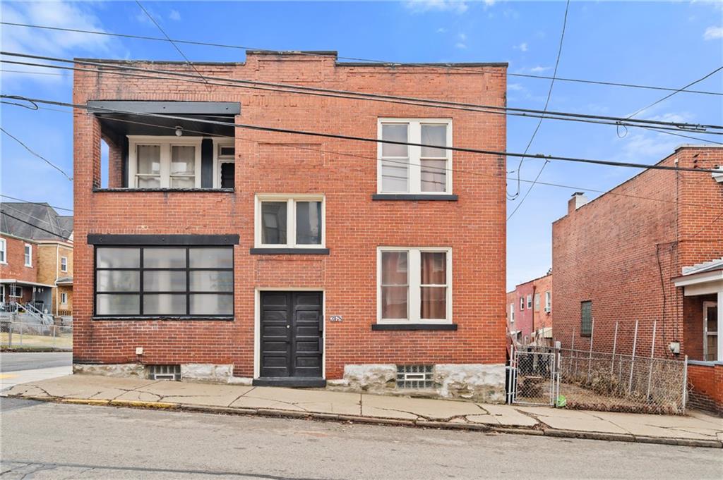 368 44th Street Pittsburgh, PA 15201 - Photo 2 of 39 a front view of a building with a road