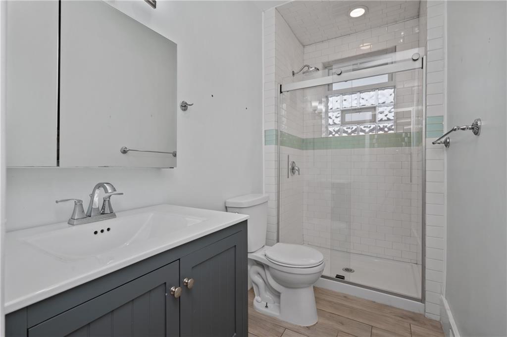 368 44th Street Pittsburgh, PA 15201 - Photo 23 of 39 a bathroom with a sink a toilet and shower