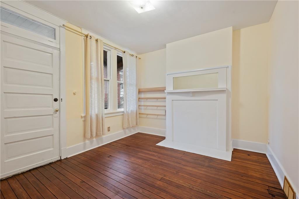 368 44th Street Pittsburgh, PA 15201 - Photo 24 of 39 a view of an empty room with wooden floor