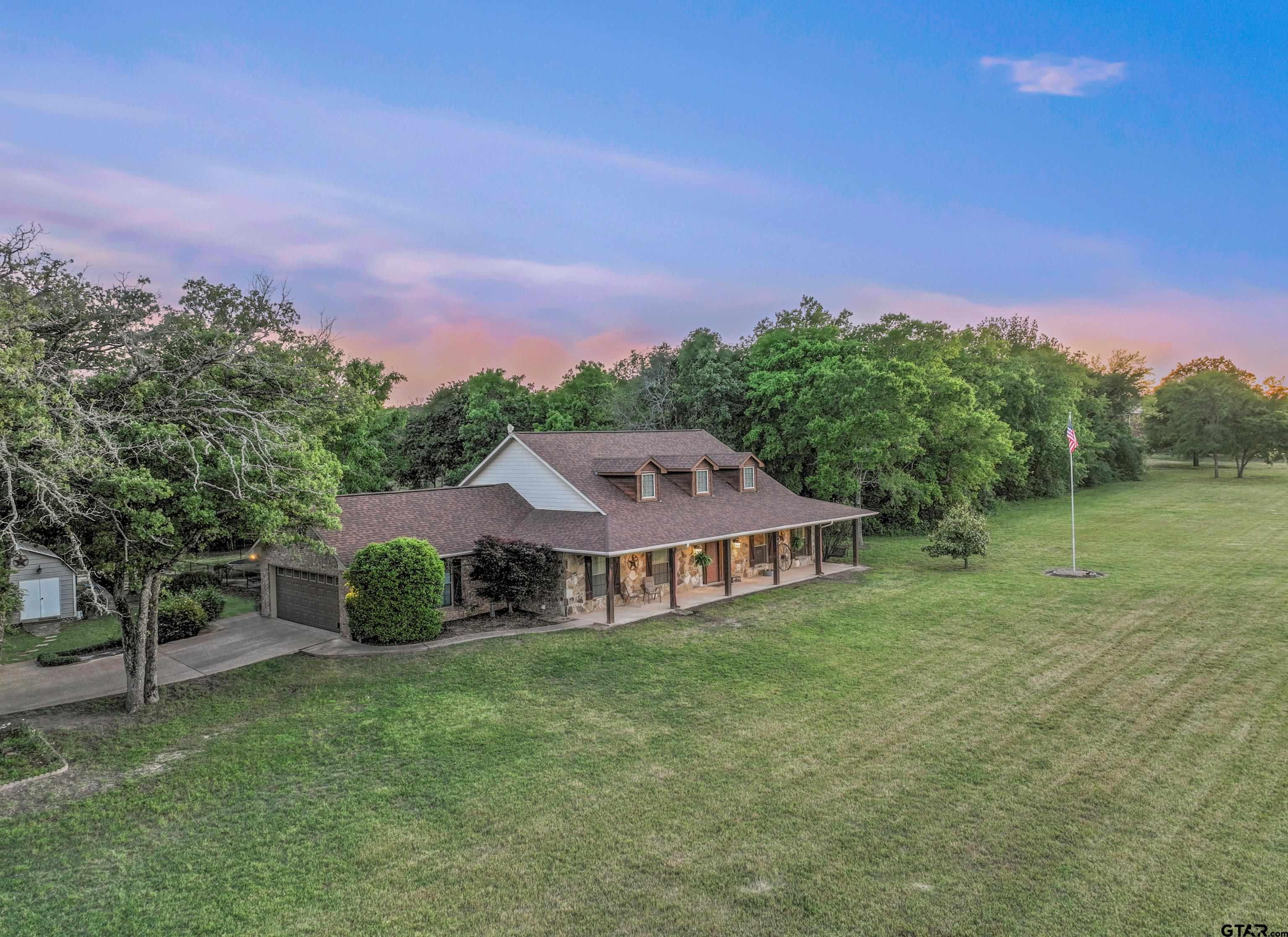 a view of a house with a big yard