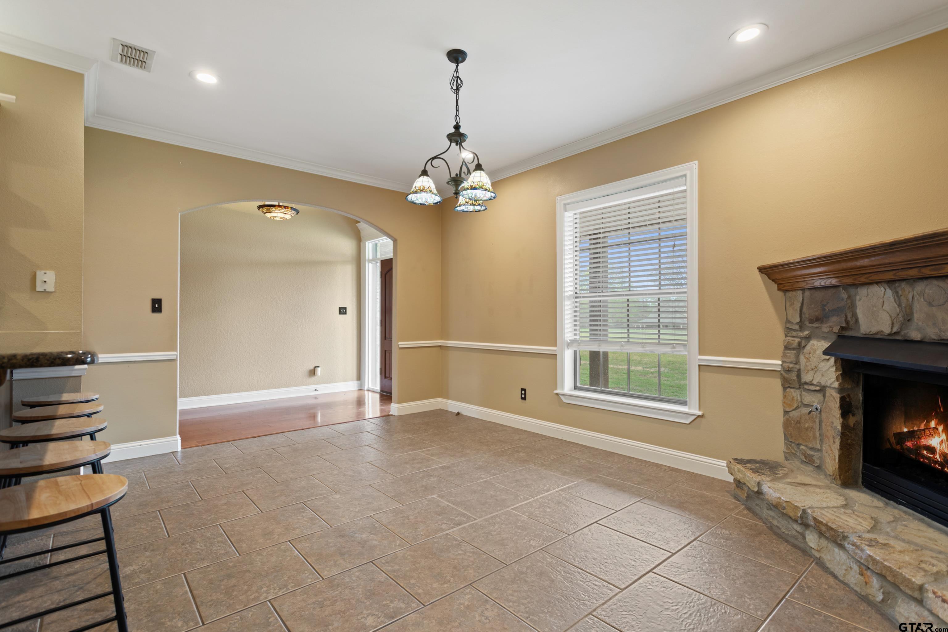 16551 Fox Run Lane Lindale, TX 75771 - Photo 11 of 41 a view of an empty room with a fireplace and a window