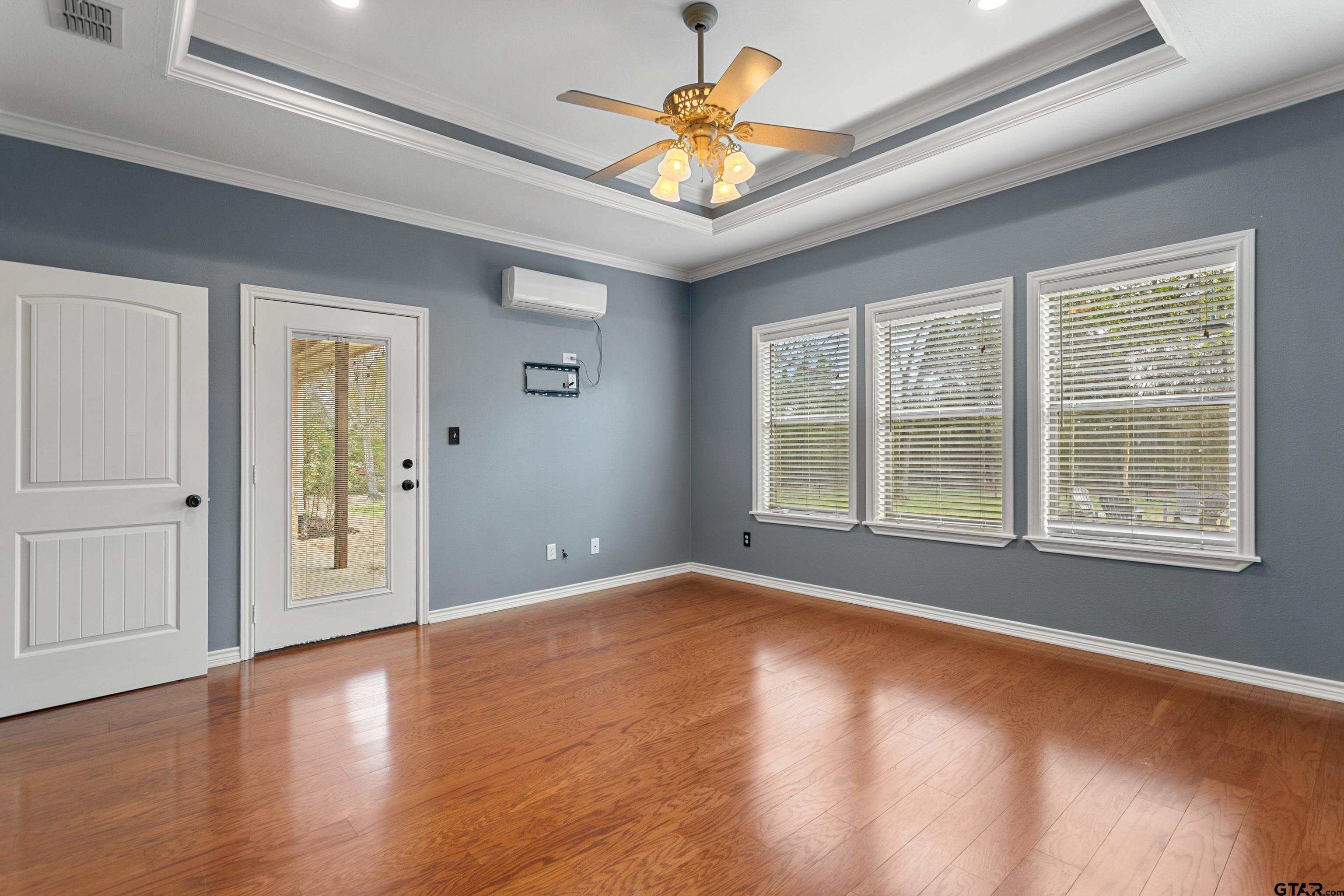 16551 Fox Run Lane Lindale, TX 75771 - Photo 14 of 41 a view of an empty room with window and wooden floor