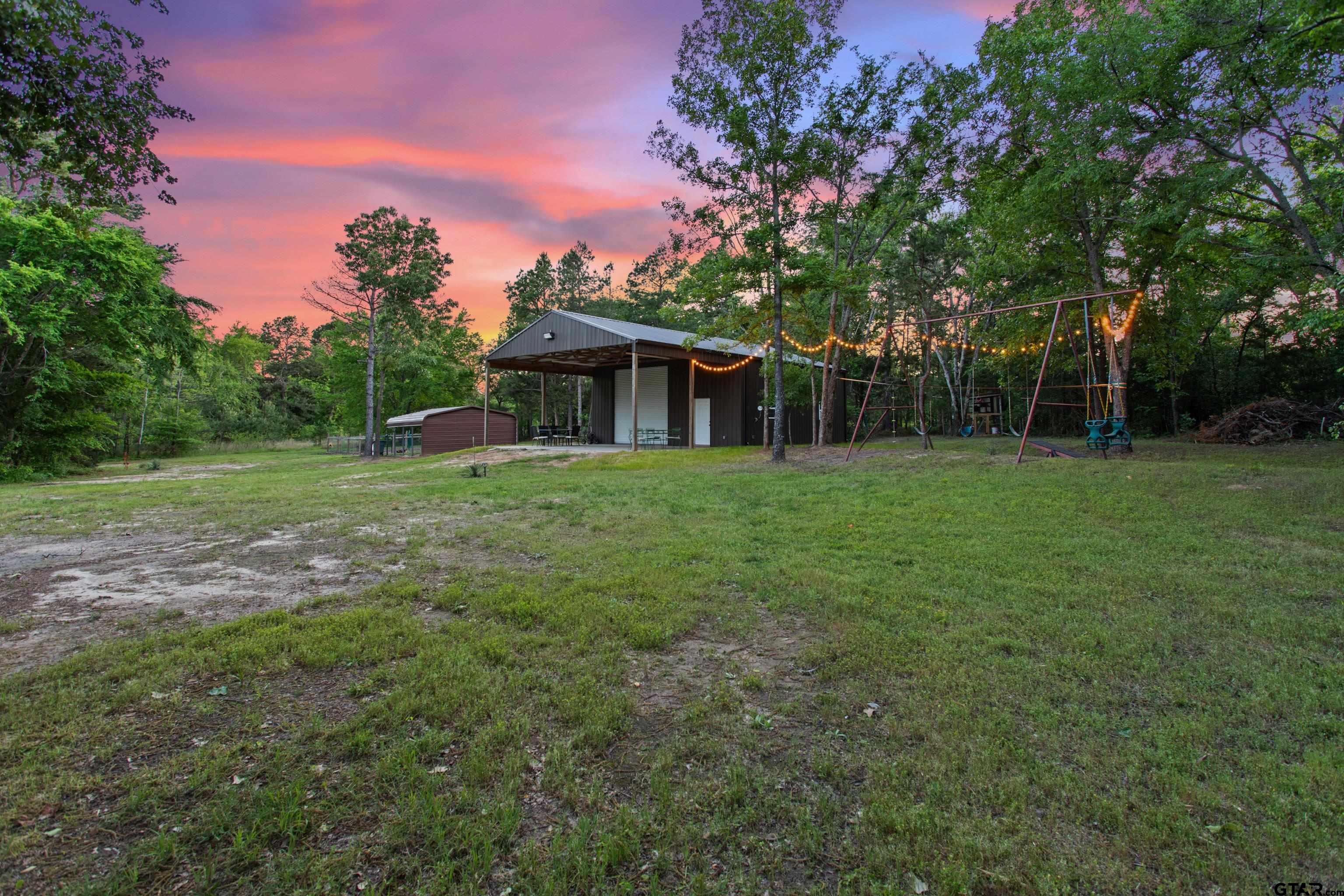 16551 Fox Run Lane Lindale, TX 75771 - Photo 31 of 41 a view of a house with a backyard