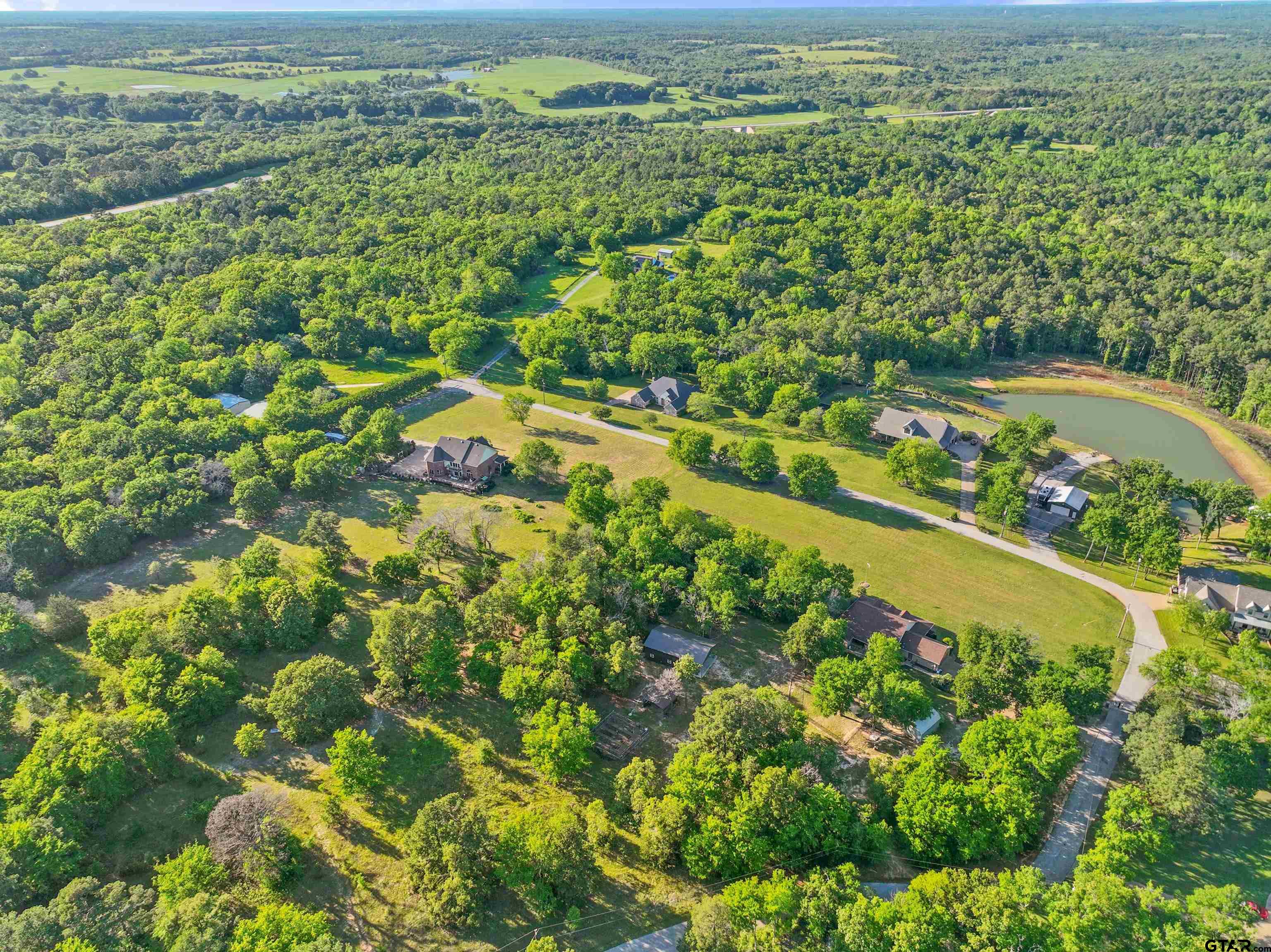 16551 Fox Run Lane Lindale, TX 75771 - Photo 35 of 41 a view of a yard with an umbrella