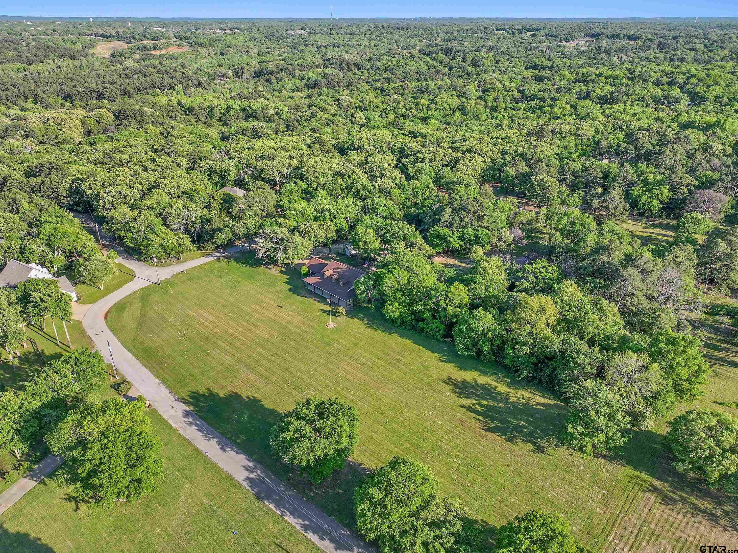 16551 Fox Run Lane Lindale, TX 75771 - Photo 36 of 41 a view of a yard with a tree