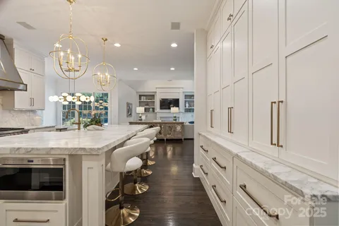a kitchen with a table and chairs