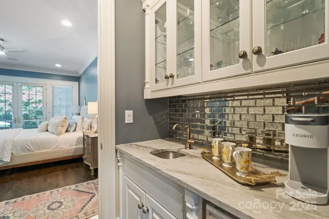 a bathroom with a sink a mirror and a shower