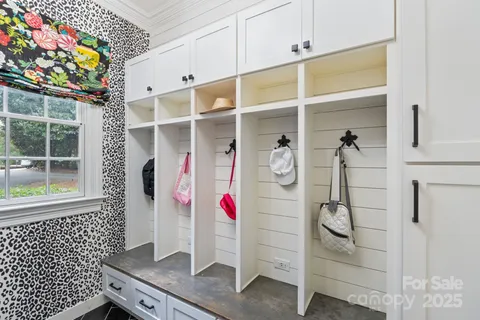 a bathroom with a double vanity sink mirror and shower