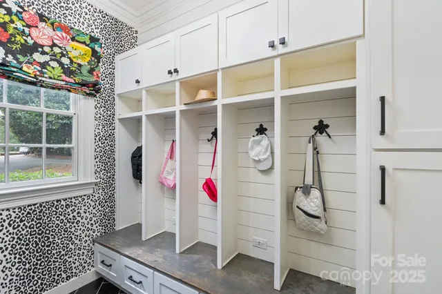 a bathroom with a double vanity sink mirror and shower