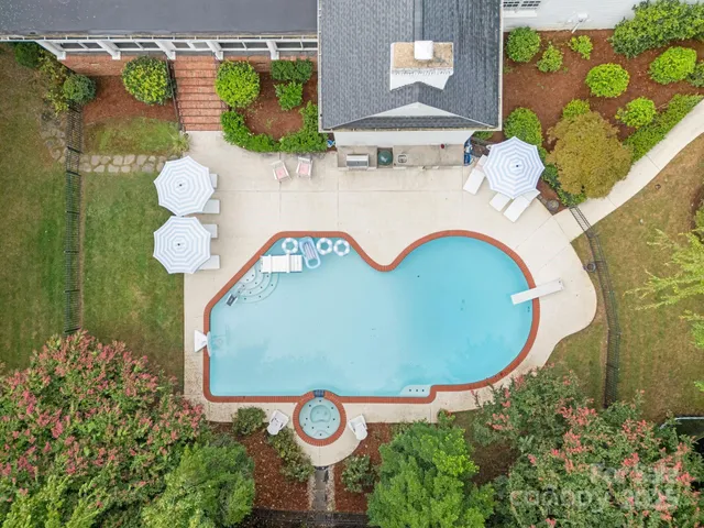 a view of entryway with a front door and wooden floor
