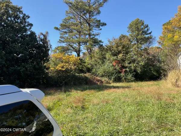 a view of swimming pool from a lake view