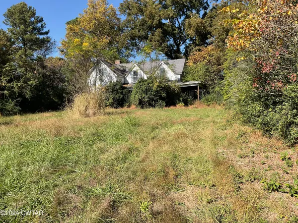 a view of a backyard of the house