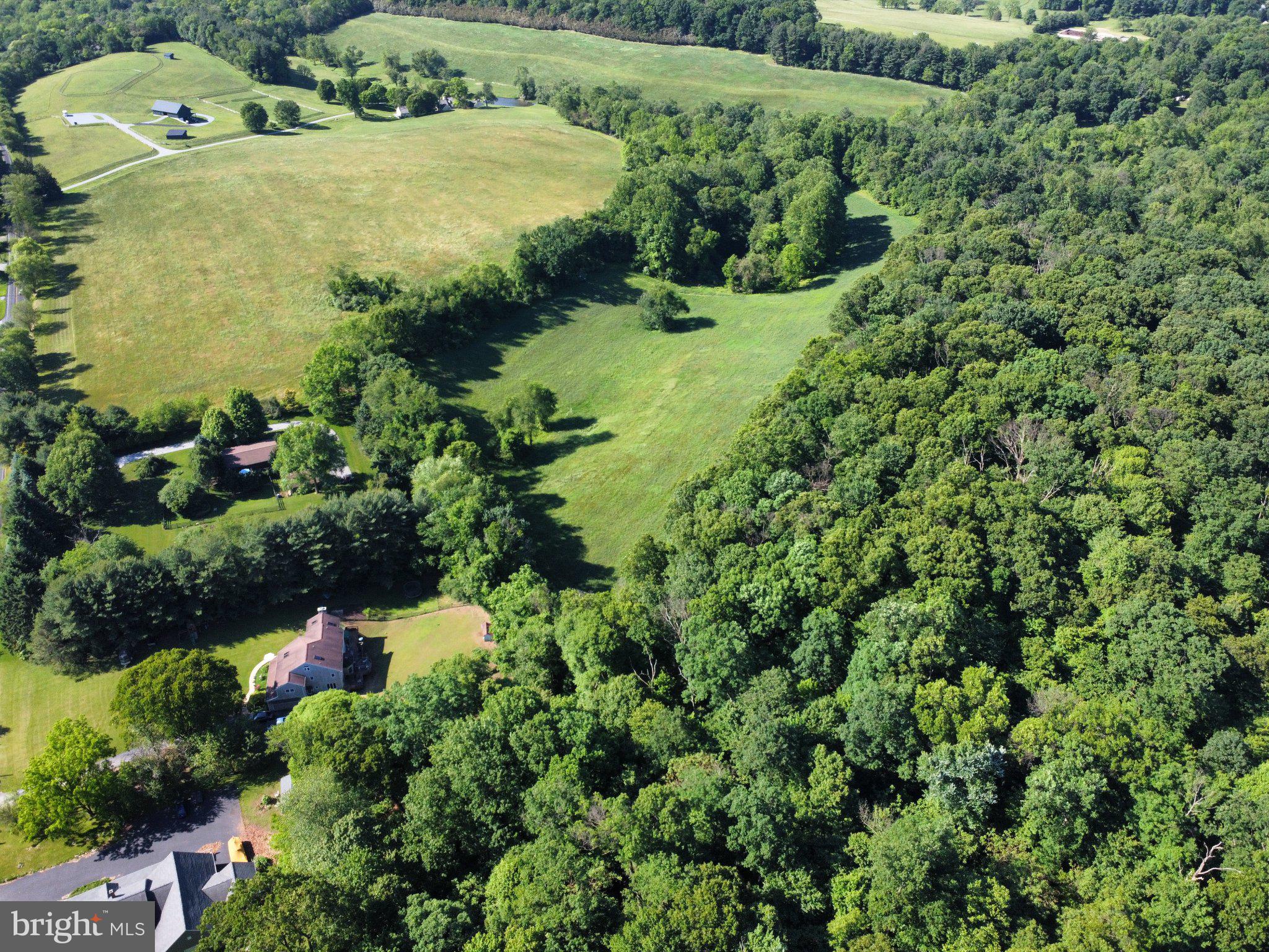 970 Doe Run Road East Fallowfield, PA 19320 - Photo 13 of 16 an aerial view of a house with a yard