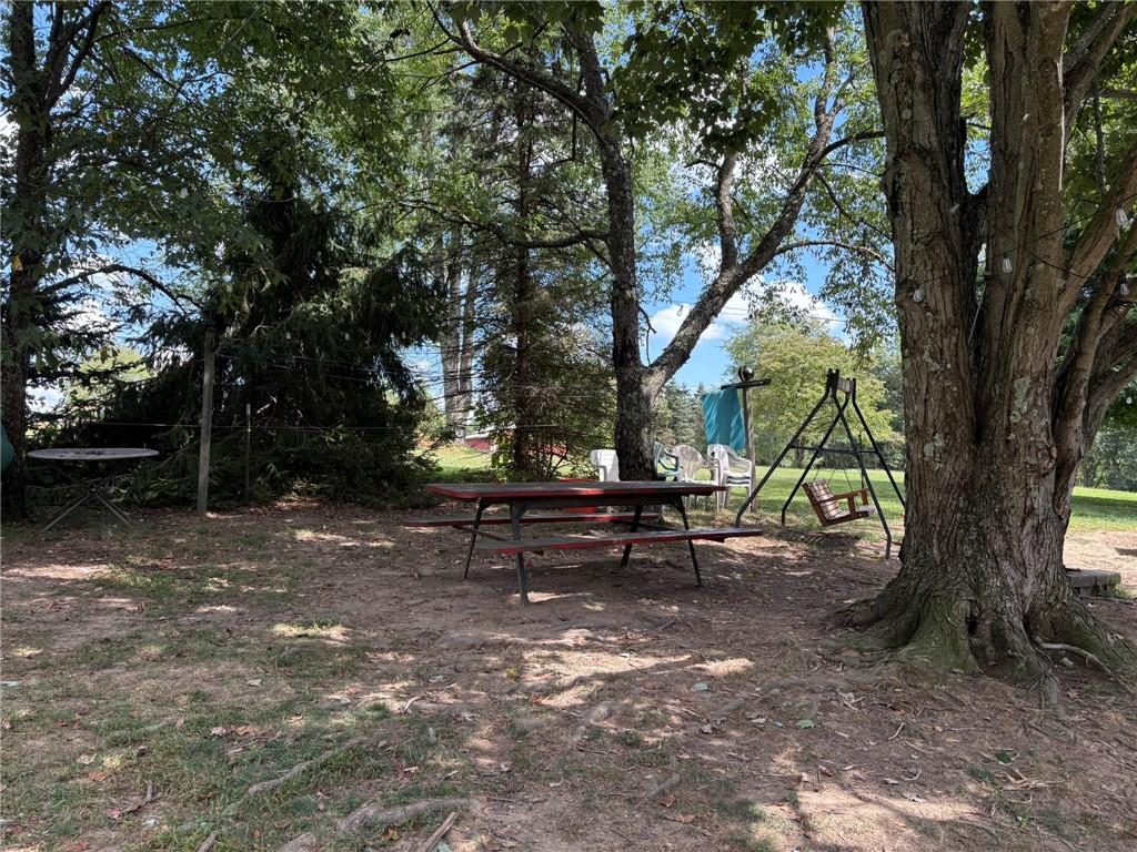 362 Hunters Lane Export, PA 15632 - Photo 15 of 17 a view of park benches sitting below a tree
