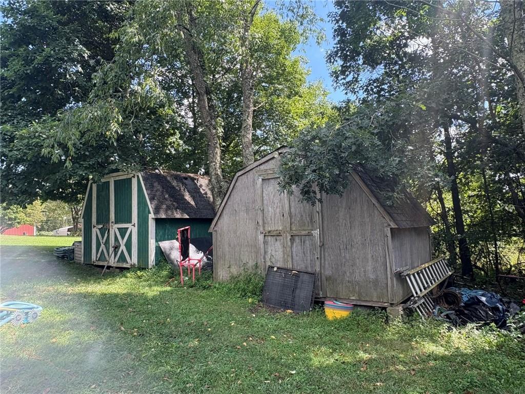 362 Hunters Lane Export, PA 15632 - Photo 16 of 17 a view of backyard with small cabin and wooden fence