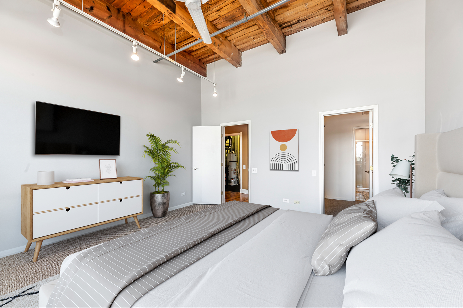 312 North May Street, Unit 5F Chicago, IL 60607 - Photo 12 of 16 a bedroom with a bed and a flat screen tv