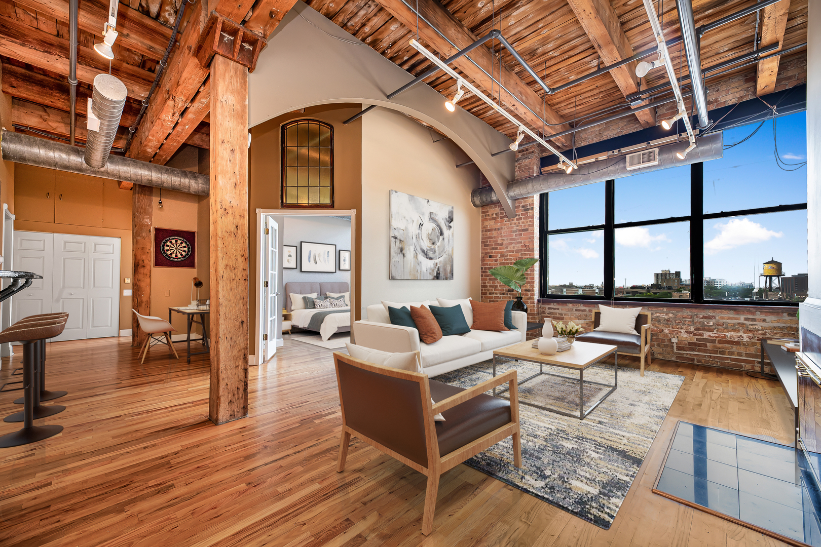 312 North May Street, Unit 5F Chicago, IL 60607 - Photo 2 of 16 a living room with furniture a wooden floor and a large window