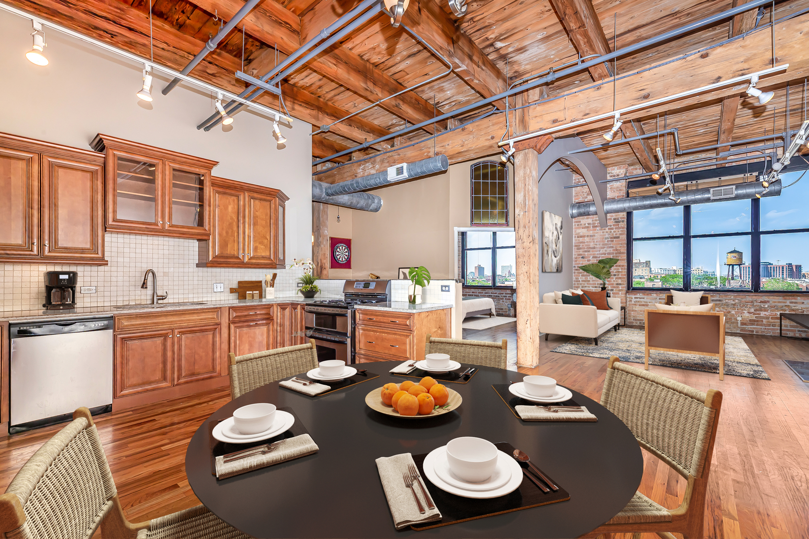 312 North May Street, Unit 5F Chicago, IL 60607 - Photo 5 of 16 a open dining room with kitchen island furniture wooden floor and kitchen view