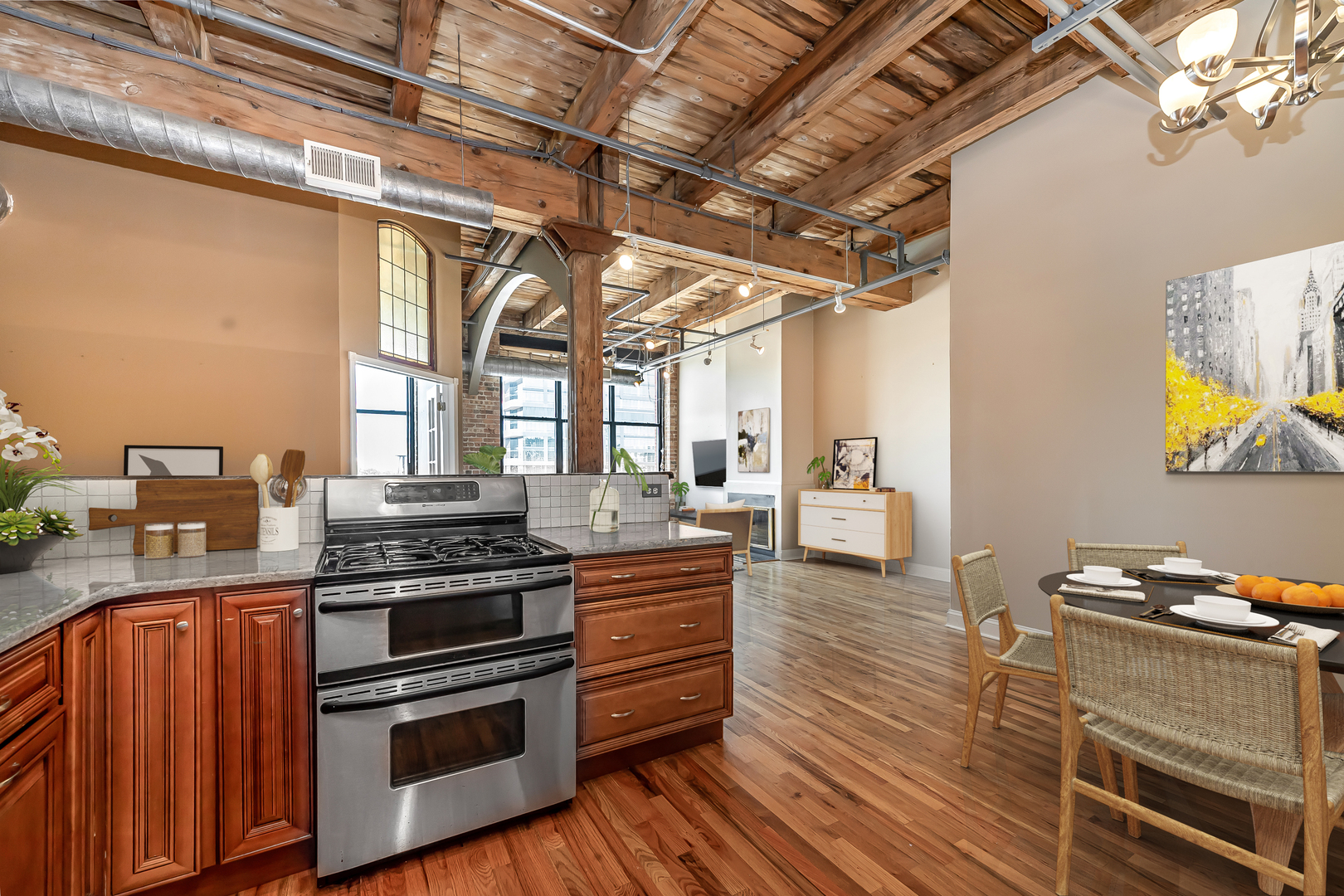 312 North May Street, Unit 5F Chicago, IL 60607 - Photo 8 of 16 a kitchen with stainless steel appliances granite countertop a stove and a sink