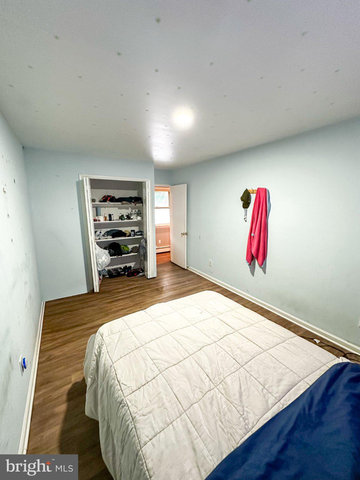 910 Magnolia Avenue Croydon, PA 19021 - Photo 11 of 23 a bedroom with a bed and a painting on the wall