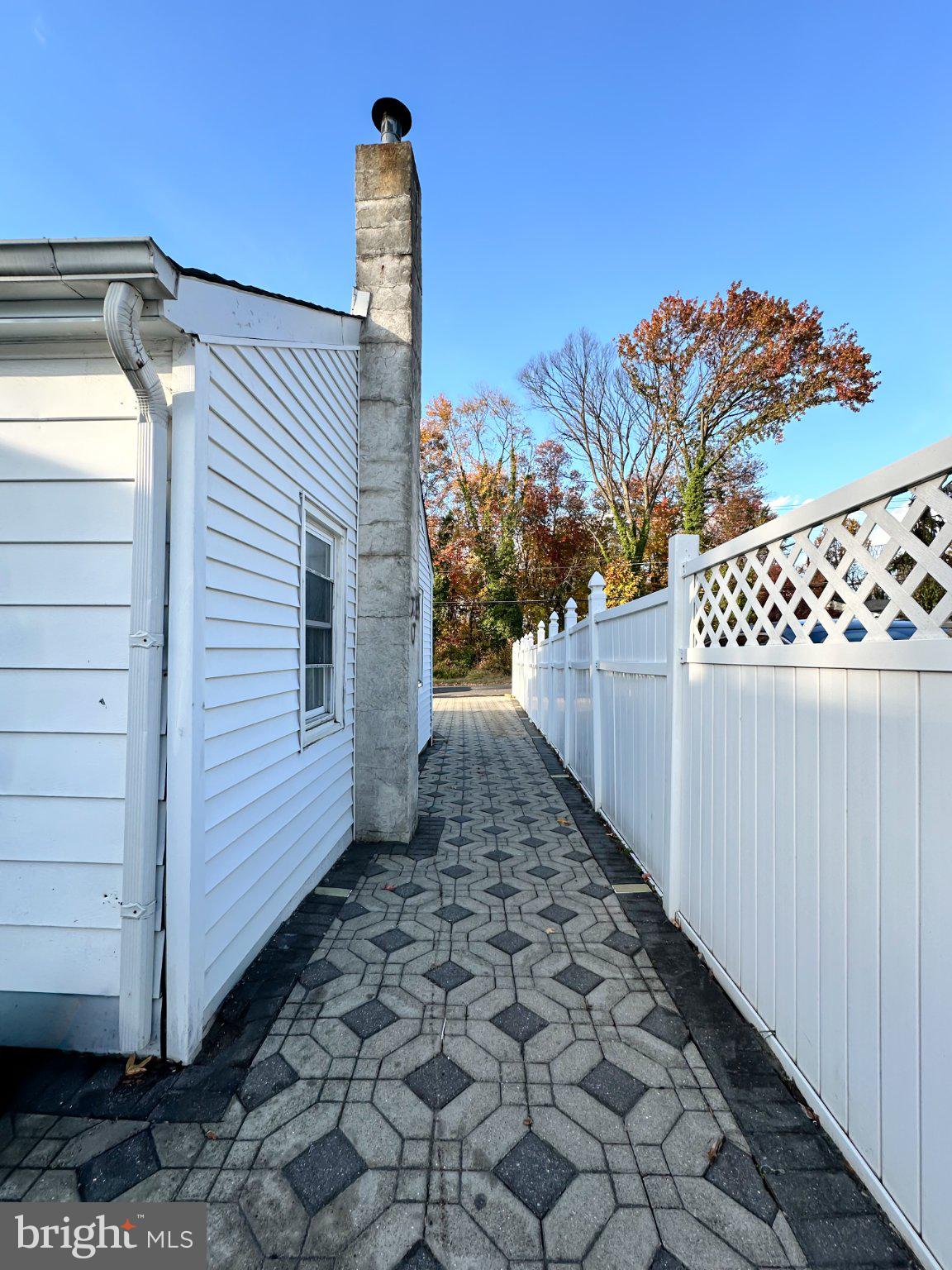 910 Magnolia Avenue Croydon, PA 19021 - Photo 21 of 23 a view of a pathway of a house with wooden fence