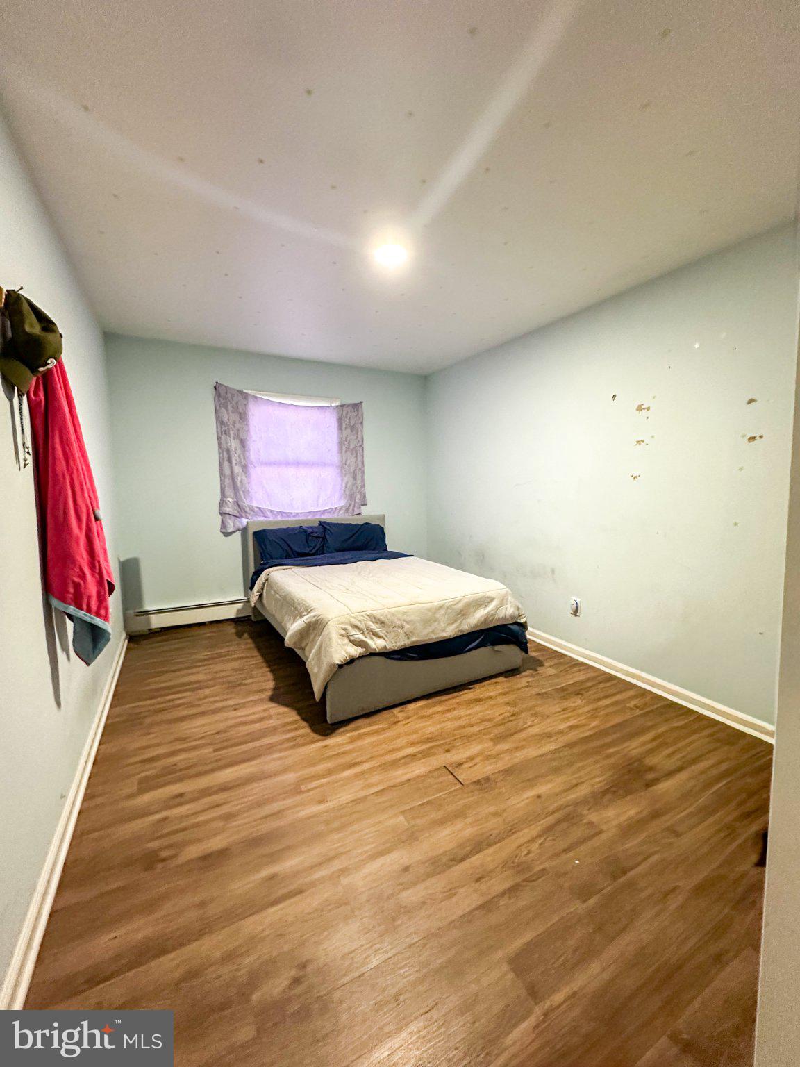 910 Magnolia Avenue Croydon, PA 19021 - Photo 10 of 23 a bedroom with a bed and a flat screen tv