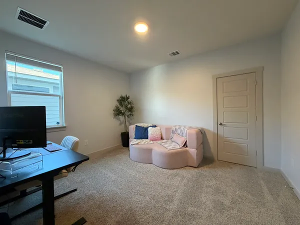a room with furniture and a flat screen tv