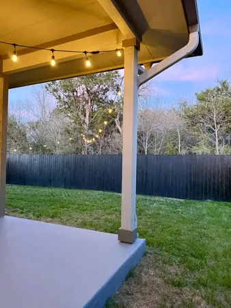a view of a backyard with a small cabin