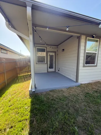 a view of a back yard of the house