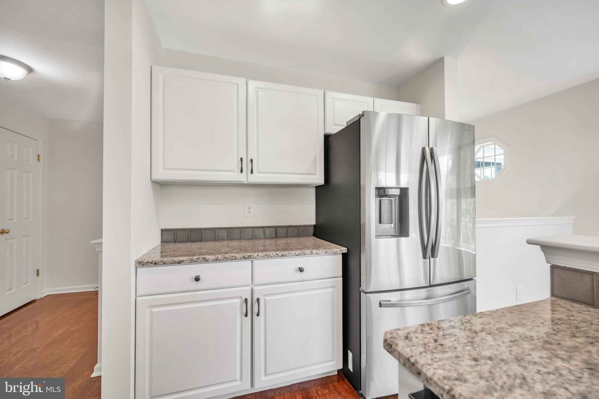 2402 Waterford Road, Unit 94 Yardley, PA 19067 - Photo 7 of 28 a kitchen with appliances a refrigerator and cabinets