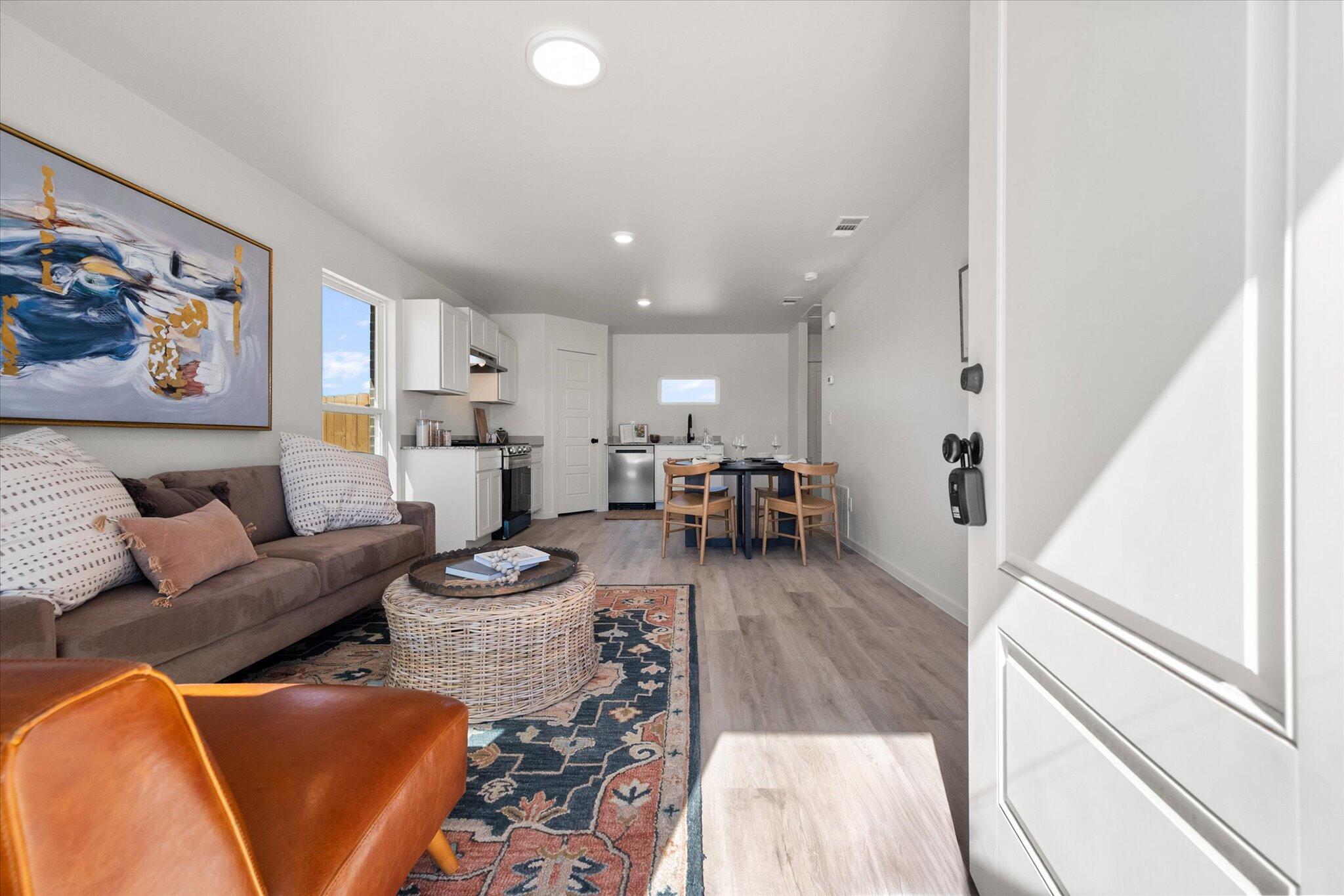 5506 Smith Street Lubbock, TX 79416 - Photo 2 of 16 a living room with furniture and a large window