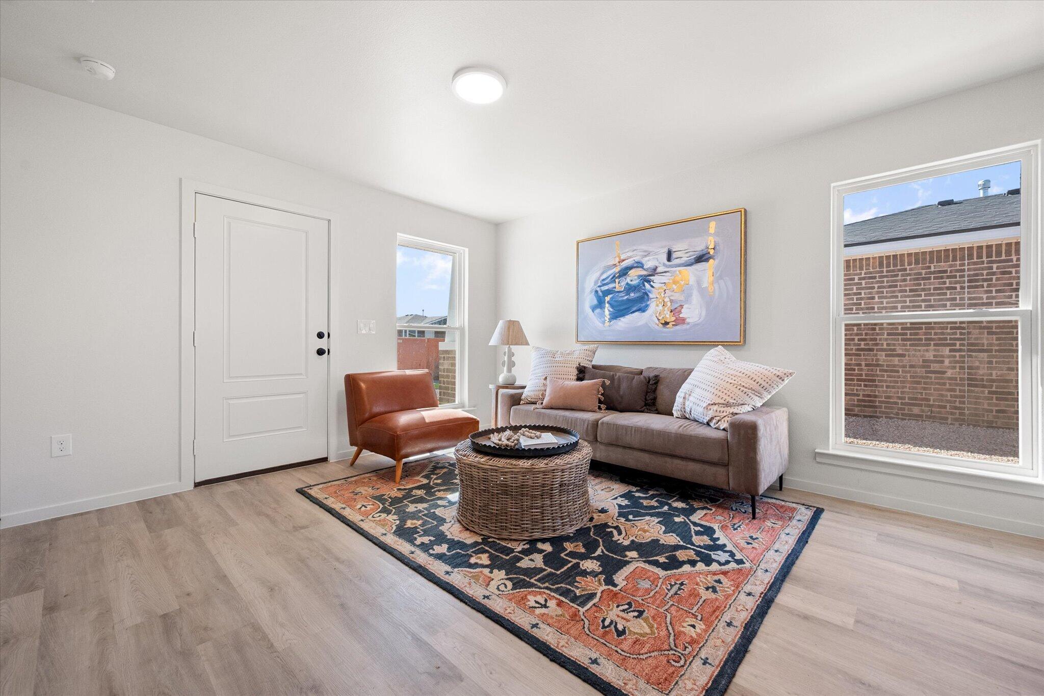 5506 Smith Street Lubbock, TX 79416 - Photo 5 of 16 a living room with furniture and a rug