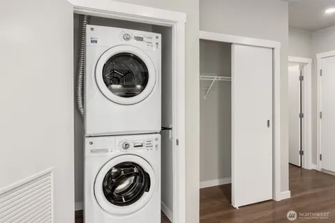 a view of a hallway with washer and dryer