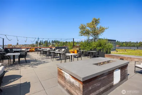 a view of a patio with a table and chairs