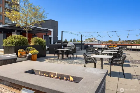a view of a patio with dining table and chairs