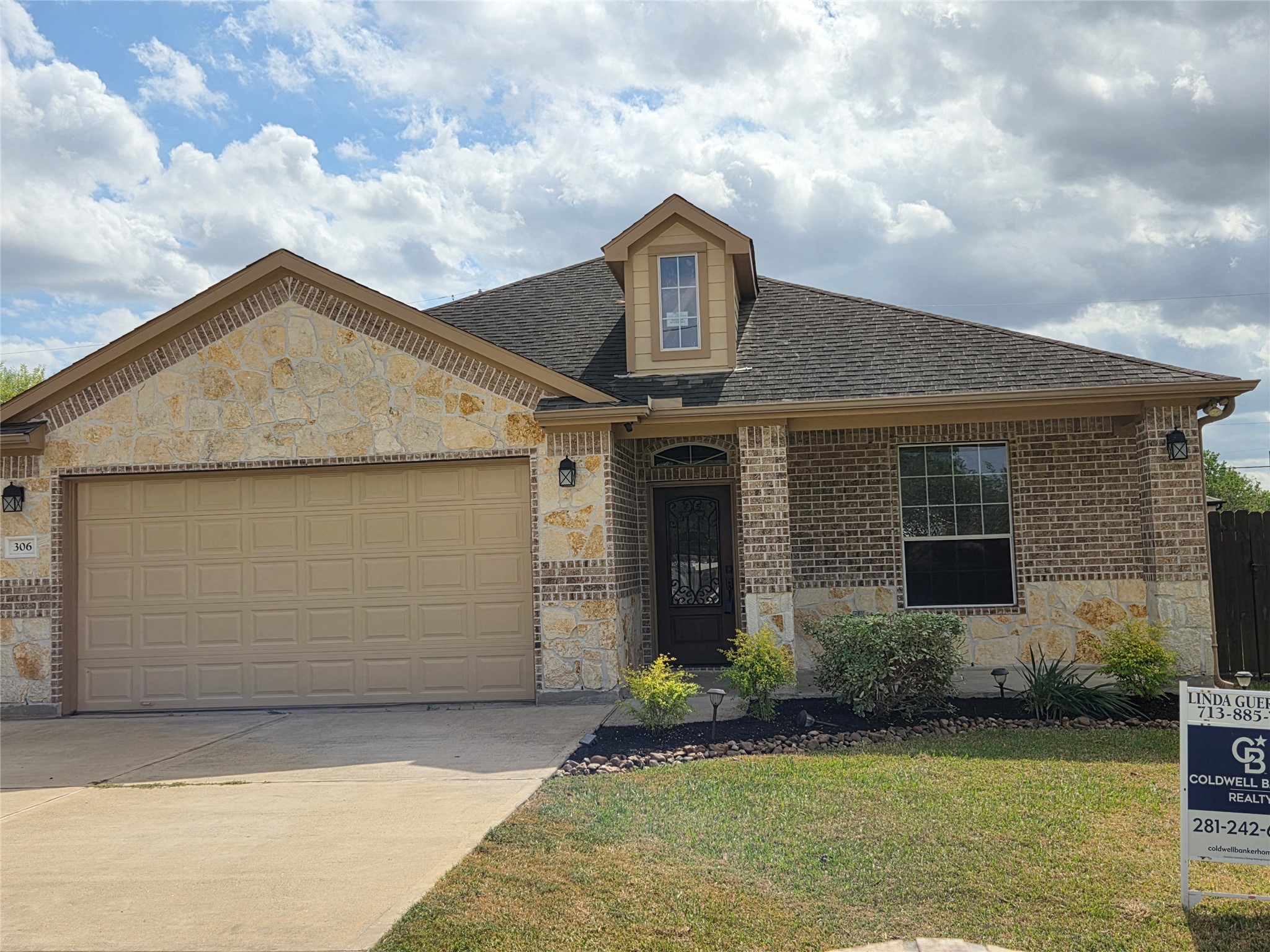 306 Masterson Street Arcola, TX 77583 - Photo 27 of 28 a front view of a house with garden