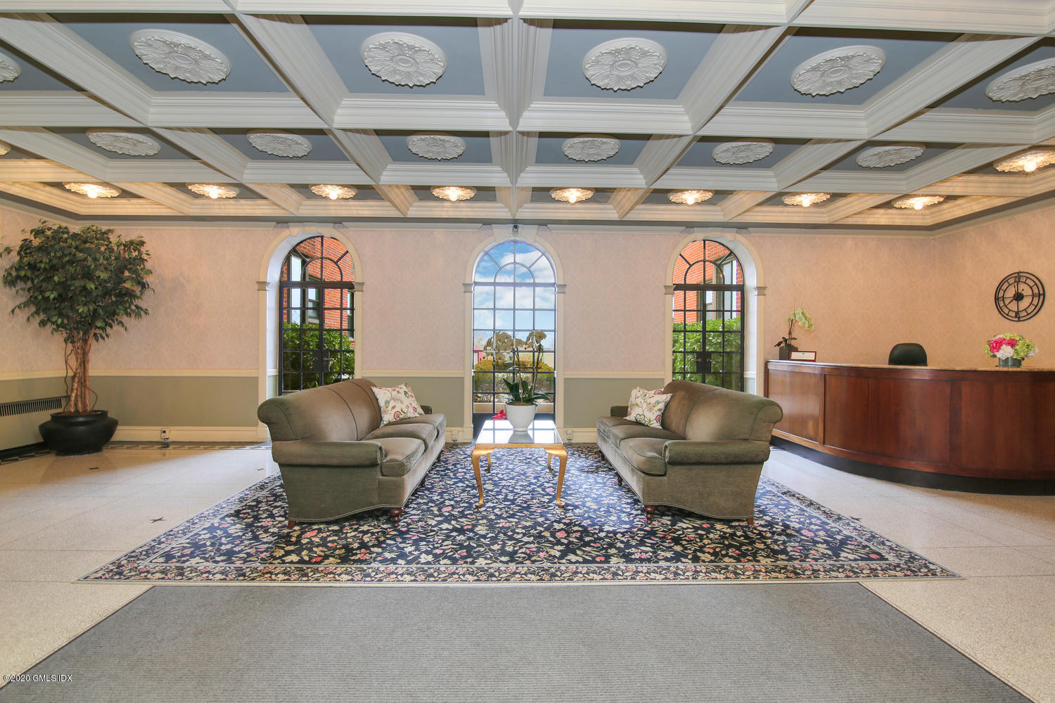 40 West Elm Street, Unit 3M Greenwich, CT 06830 - Photo 1 of 19 a living room with furniture and a chandelier
