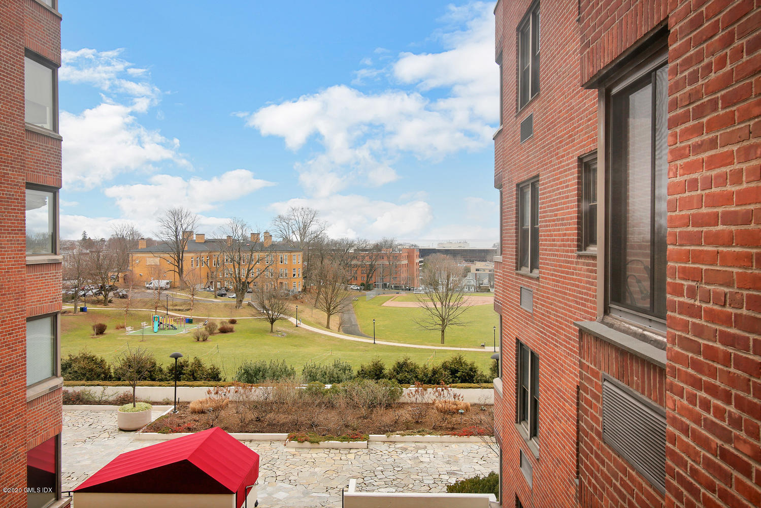 40 West Elm Street, Unit 3M Greenwich, CT 06830 - Photo 16 of 19 a view of a city with tall buildings