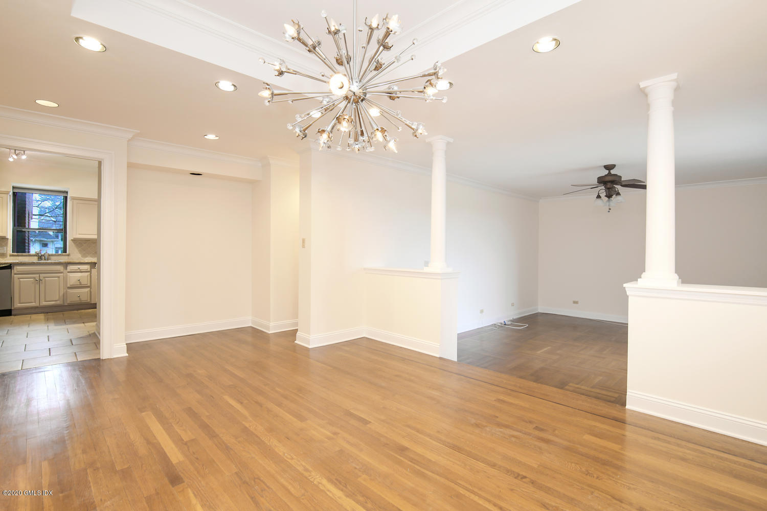 40 West Elm Street, Unit 3M Greenwich, CT 06830 - Photo 2 of 19 wooden floor in an empty room with a window