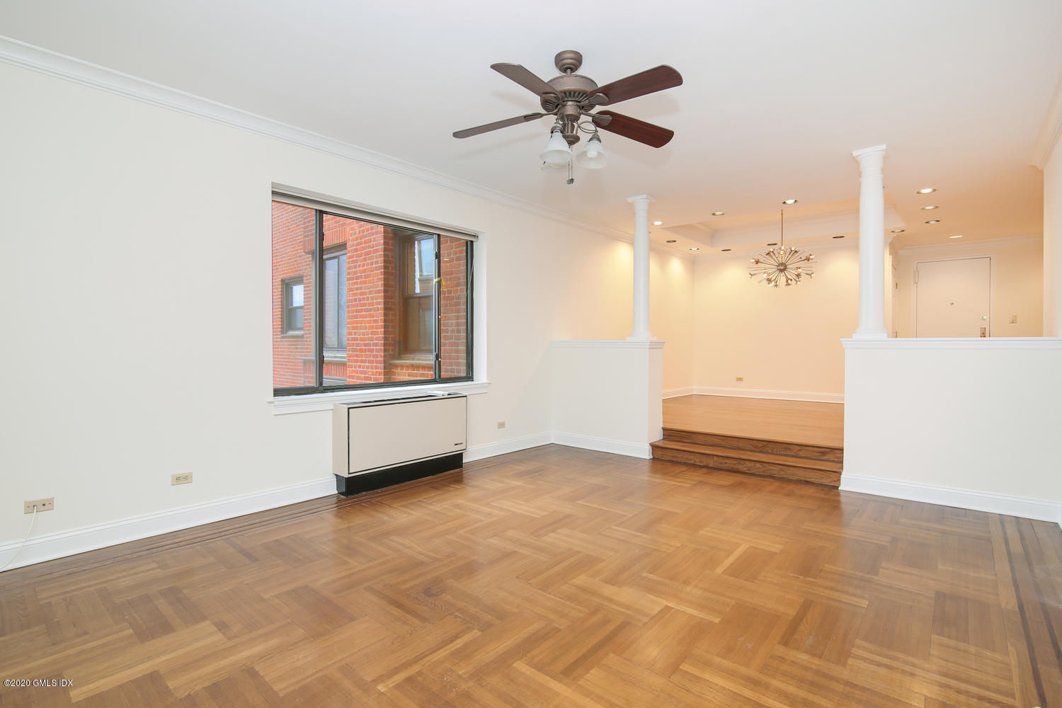 40 West Elm Street, Unit 3M Greenwich, CT 06830 - Photo 7 of 19 an empty room with a ceiling fan and a window