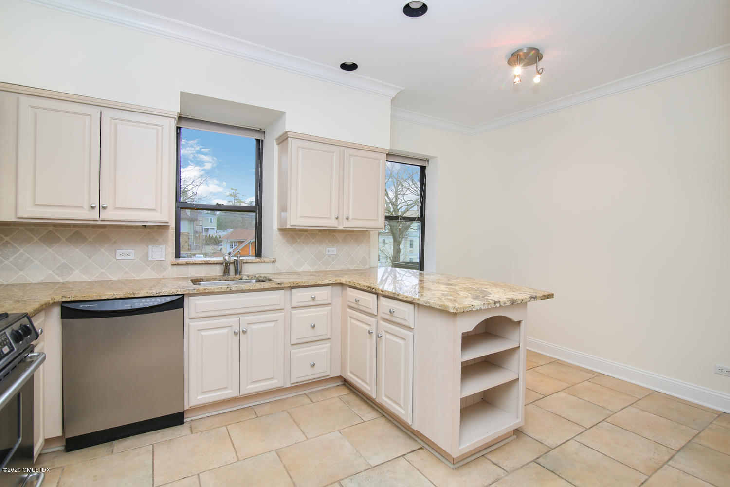 40 West Elm Street, Unit 3M Greenwich, CT 06830 - Photo 8 of 19 a kitchen with a sink and cabinets