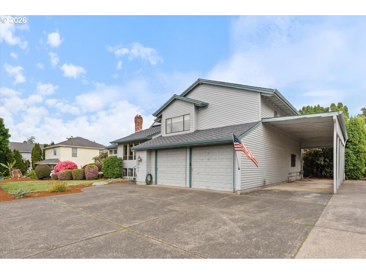 17501 Northeast Clackamas Street Portland, OR 97230 - Photo 2 of 38 a view of a white house with a yard and garage