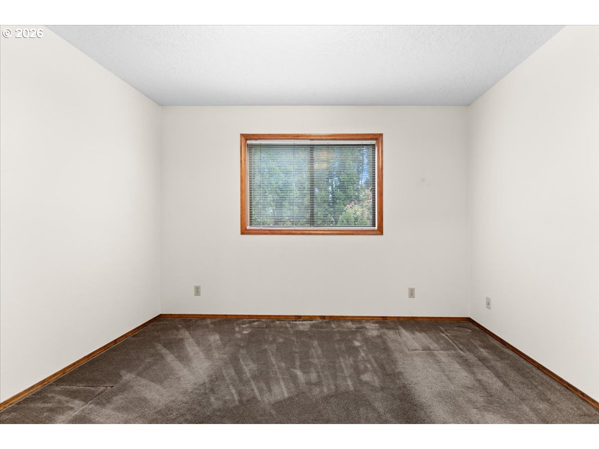 17501 Northeast Clackamas Street Portland, OR 97230 - Photo 21 of 38 an empty room with wooden floor and window