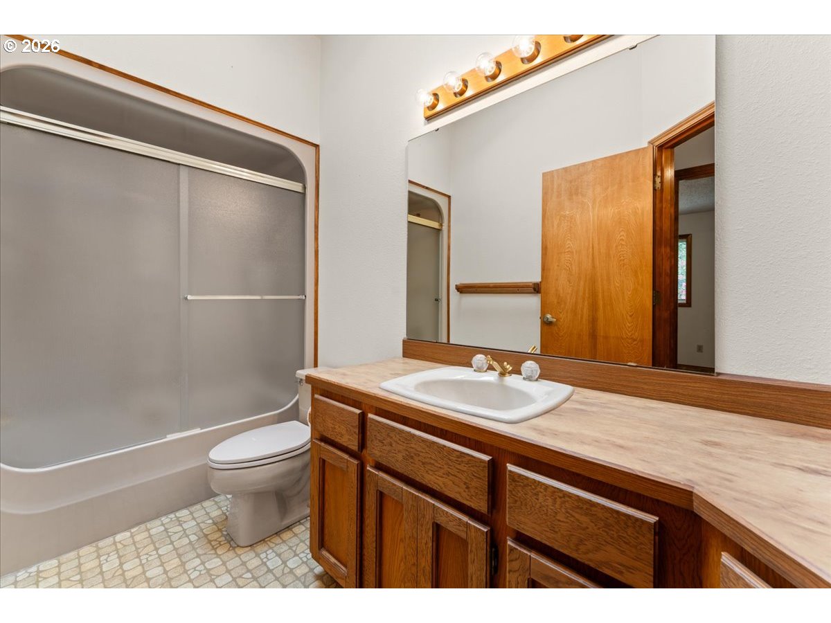 17501 Northeast Clackamas Street Portland, OR 97230 - Photo 25 of 38 a bathroom with a sink a toilet and shower