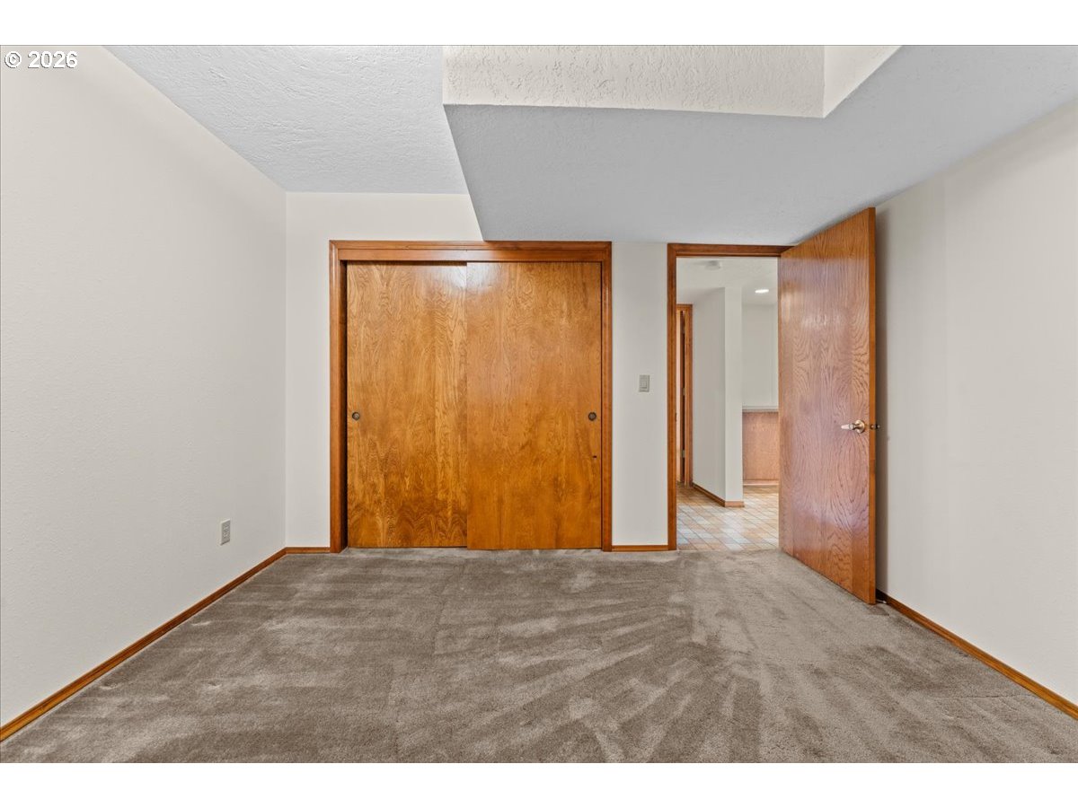 17501 Northeast Clackamas Street Portland, OR 97230 - Photo 31 of 38 a view of an empty room with wooden floor