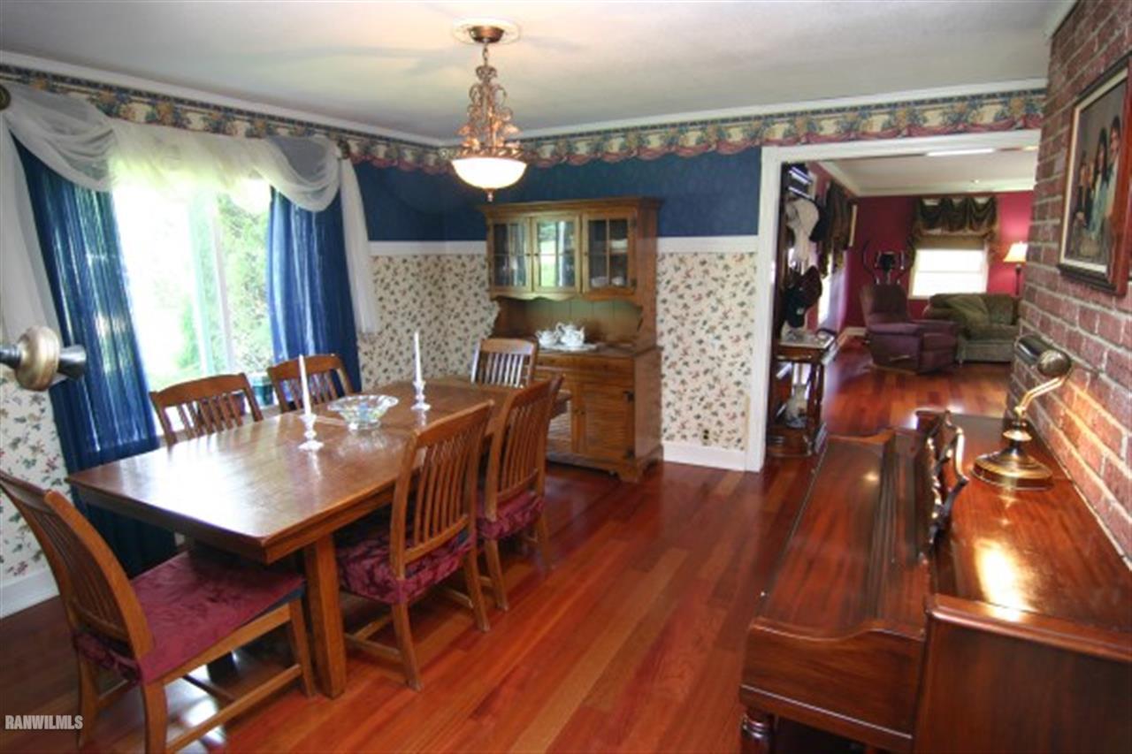 6031 West Kermit Road Freeport, IL 61032 - Photo 5 of 12 a view of a dining room with furniture and wooden floor