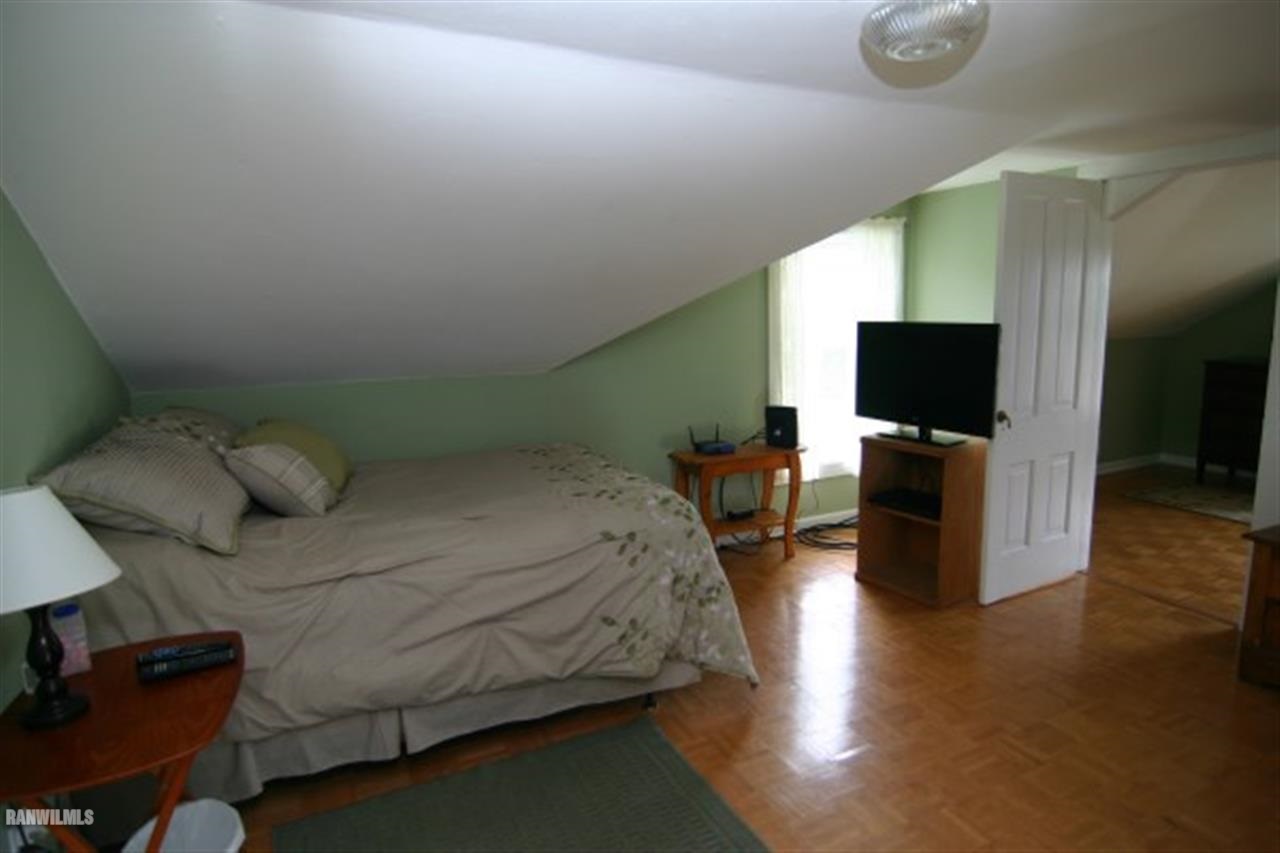 6031 West Kermit Road Freeport, IL 61032 - Photo 8 of 12 a bed room with a bed tv and a television