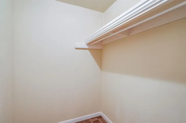 a view of a room with wooden stairs
